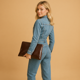 Blue denim jumpsuit for women with straight legs and long sleeves.