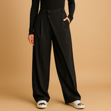 Asymmetrical baggy pants with double button closure for women