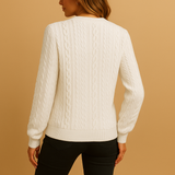Casual knitted women's sweater with round neck and texture.