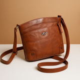 Compact shoulder bag with solid color and elegant finish for women.