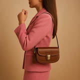 Crossbody bag with flap closure and timeless design for women.