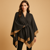 Elegant women's poncho with open sides and a flowing fit.