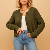 Knitted women's cardigan with buttons.