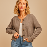 Knitted women's cardigan with buttons.