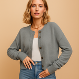 Knitted women's cardigan with buttons.