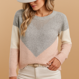 Knitted women's sweater with a relaxed fit.