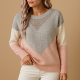 Knitted women's sweater with a relaxed fit.