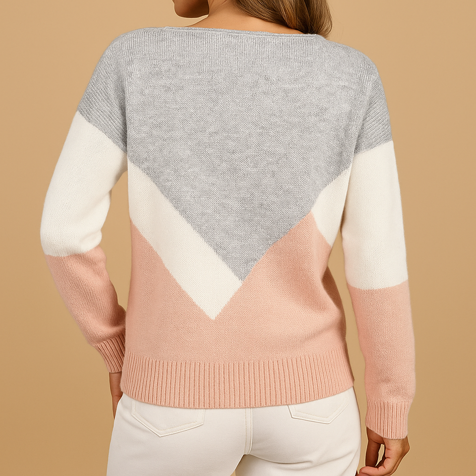 Knitted women's sweater with a relaxed fit.