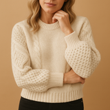 Knitted women's sweater with round neck.