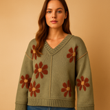 Knitted V-neck women's sweater with floral pattern.