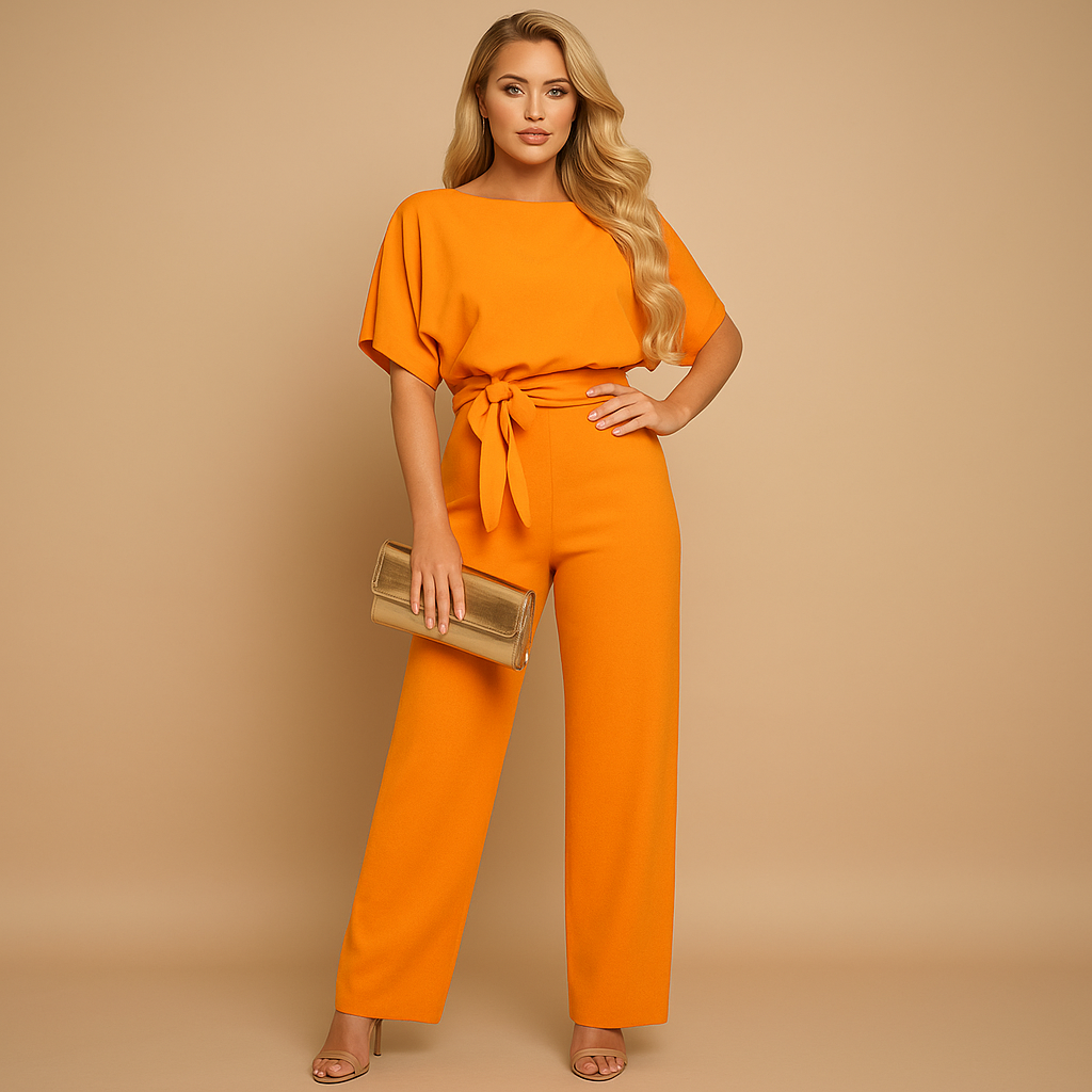 Glitter jumpsuit with halter neck and open back for women.