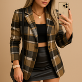 Long quilted women's blazer with check pattern.
