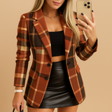 Long quilted women's blazer with check pattern.