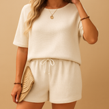 Loungewear set with separate top and shorts for women.