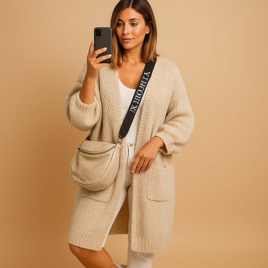 Oversized women's cardigan with open front and elegant cut.
