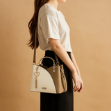 Shoulder bag with geometric pattern and adjustable strap for women.