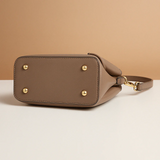 Shoulder bag with geometric pattern and adjustable strap for women.