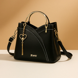 Shoulder bag with geometric pattern and adjustable strap for women.