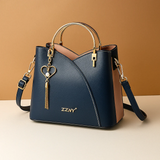 Shoulder bag with geometric pattern and adjustable strap for women.