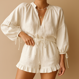 Women's V-neck top and shorts with ruffles.