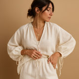 Women's V-neck top and shorts with ruffles.