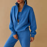 Two-piece jogging suit with half zipper for women.