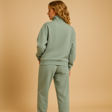Two-piece jogging suit with half zipper for women.