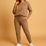 Two-piece women's tracksuit with a high collar and elastic waist.