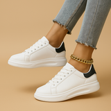 White leather sneakers with minimalist design for women