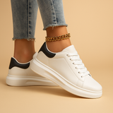 White leather sneakers with minimalist design for women