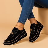 White sneakers with gold detailing for women